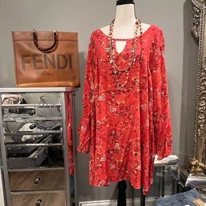 This red with colored detail top is a cute loop hole at the  top flared sleeves